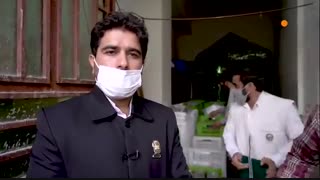 توزیع غذای متبرک توسط خادمان آستان قدس رضوی